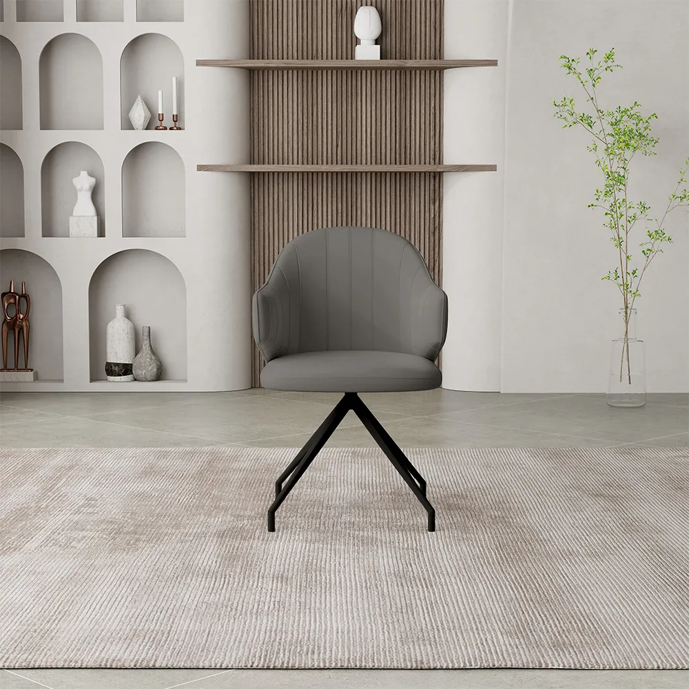 With its exceptional dynamic interactivity and quintessential modern industrial aesthetic, this Modern 180° Swivel Dining Chair has emerged as a highly acclaimed and innovative product within the current international furniture procurement market. As a specialized manufacturer deeply rooted in the high-end furniture sector, we possess a keen insight into the specific needs of B2B clients regarding the balance between product functionality and spatial efficiency. The core technical selling point of this swivel dining chair series lies in its built-in, precision-engineered 180-degree auto-return swivel system. Utilizing a mechanism featuring thickened, high-grade steel ball bearings, this system has successfully passed rigorous fatigue testing involving 100,000 rotation cycles. This design allows users to engage in effortless conversation—whether dining or conducting business discussions—through smooth left-to-right rotation; furthermore, upon vacating the seat, the chair body automatically and precisely returns to its original forward-facing position, thereby consistently maintaining the neat and uniform layout of dining areas, conference rooms, or public lounges. This highly efficient auto-return functionality significantly reduces the labor costs associated with on-site tidying in high-end hotels and executive office environments, while simultaneously elevating the overall standard of spatial management. In terms of material composition and sensory experience, we remain committed to utilizing high-specification raw materials that meet stringent international environmental standards. The upholstered components of the seat are clad in engineering-grade fabrics or premium leathers—selected for their superior breathability and abrasion resistance—offering a refined tactile feel combined with exceptional stain-resistant properties. The internal cushioning features high-density, cold-molded foam; its unique molecular structure ensures precise lumbar support is maintained even under conditions of prolonged, high-frequency use, effectively preventing the common issue of structural collapse often observed in traditional swivel chairs. The base frame is crafted from high-strength carbon steel, seamlessly formed as a single unit using advanced CNC tube-bending technology. Finished with an electrostatic powder coating process, the frame not only boasts a sophisticated matte aesthetic but also guarantees structural stability under heavy loads and provides robust resistance against oxidation. Finally, the design—characterized by gently angled armrests and a contoured, wraparound backrest—is meticulously engineered to align with the natural physiological curves of the human body, aiming to deliver a consistently high level of comfort for users of all body types. Our manufacturing prowess is anchored in a state-of-the-art, intelligent industrial facility spanning 50,000 square meters. This facility is equipped with a comprehensive suite of cutting-edge machinery, including fully automated CNC cutting systems, intelligent robotic welding stations, and high-precision sewing assembly lines. From the precision laser cutting of every inch of fabric to the fine-tuning of the rotational mechanism's load balance, we have established a closed-loop quality control system encompassing raw material re-inspection, in-process monitoring, and final product inspection. This robust foundation in industrial manufacturing empowers us with exceptional capabilities in OEM and ODM customization services. Whether it involves exclusive color matching tailored to specific interior design schemes or structural R&D modifications for brand partners, our technical team provides expert support—from initial design concepts to final sample approval—within remarkably short turnaround times. Currently, the company holds ISO certification and numerous international safety certifications, with our products enjoying strong sales across major global furniture markets, including North America and Europe. Leveraging the strategic advantage of our proximity to key international shipping hubs, we have developed highly responsive and cost-competitive logistics solutions for our global partners, effectively shortening cross-border supply chain delivery cycles. For large-volume wholesale orders, our standard production lead time is strictly maintained within 30 to 45 days, ensuring that your commercial projects or retail inventory replenishment proceed exactly as scheduled. Regarding our service assurance chain, we offer comprehensive, closed-loop support—ranging from pre-sales space planning and sample approval to in-process production progress updates and long-term after-sales quality warranties. We support a wide range of mainstream payment methods, aiming to simplify transaction complexities for global buyers. Choosing this modern 180-degree swivel dining chair means acquiring not just a highly distinctive and best-selling product, but also securing a strategic partner backed by stable production capacity, impeccable quality control, and end-to-end service capabilities. With its unique functional interactivity and reliable intrinsic quality, this product will empower you to precisely target high-end clientele and generate sustainable commercial value within the fiercely competitive furniture trade landscape.